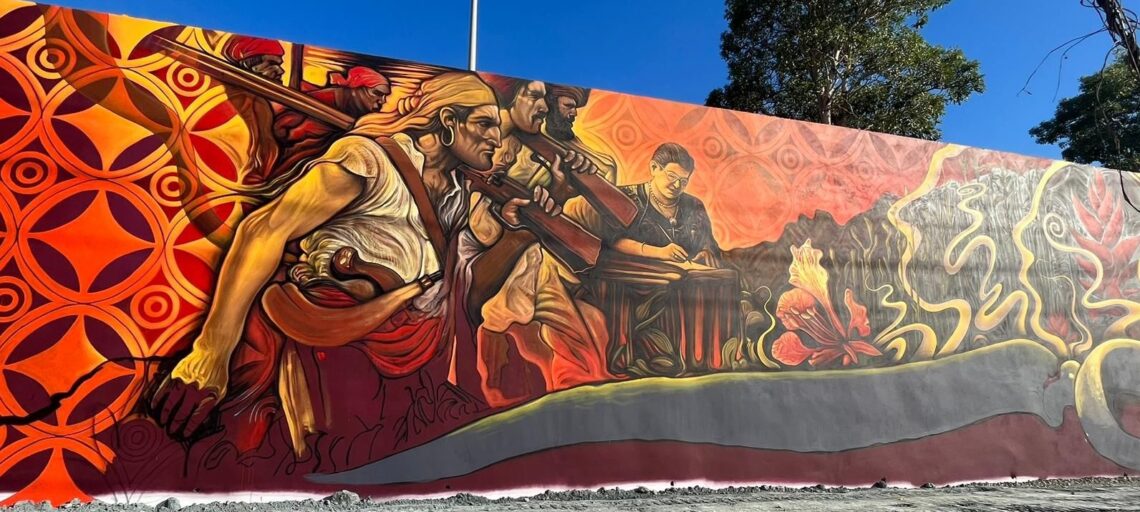 Con 15 mil pies cuadrados de vivas y seductoras imágenes, el macro mural Los Espíritus de la Loma es desde ya la obra maestra del artista puertorriqueño Rafael “Rafique” Vega. (Foto suministrada)